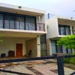 Modern two-story house with garden.