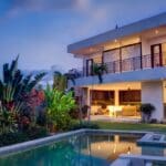 Modern house with pool and tropical garden.