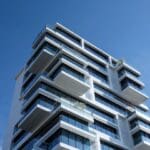 Modern high-rise building against blue sky.