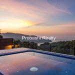 Rooftop pool with sunset view.