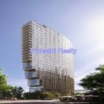 Modern high-rise building under clear sky.