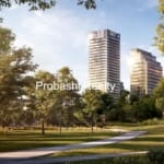 Park with skyscrapers and walking person, daytime.