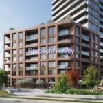 Modern brick apartment building with green landscaping.