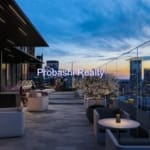 Rooftop lounge with city skyline view.