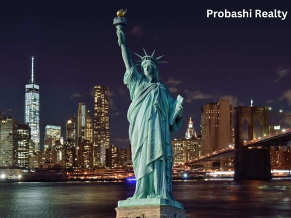 Statue of Liberty with city skyline background.