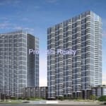 Two modern high-rise buildings against sky.