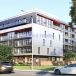 Modern multi-story residential building with cars.