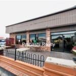 Brick building with outdoor seating area.