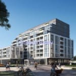 Modern urban apartment building with trees.