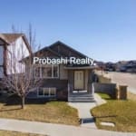 Suburban house with "Probashi Realty" text overlay.