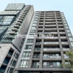 Modern high-rise apartment building exterior view.