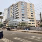 Multi-story building on a busy street.