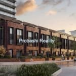 Modern apartment complex at sunset.