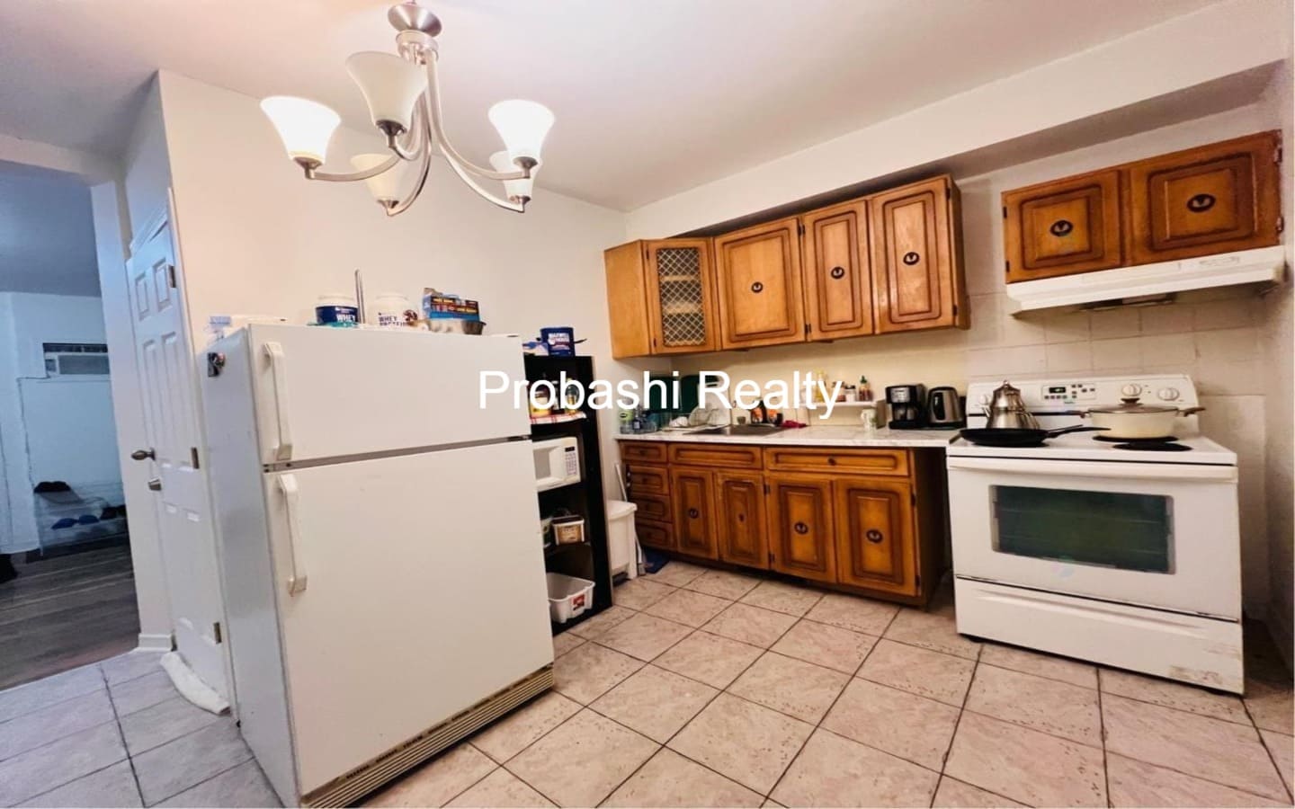 Cozy kitchen with wooden cabinets and modern appliances.